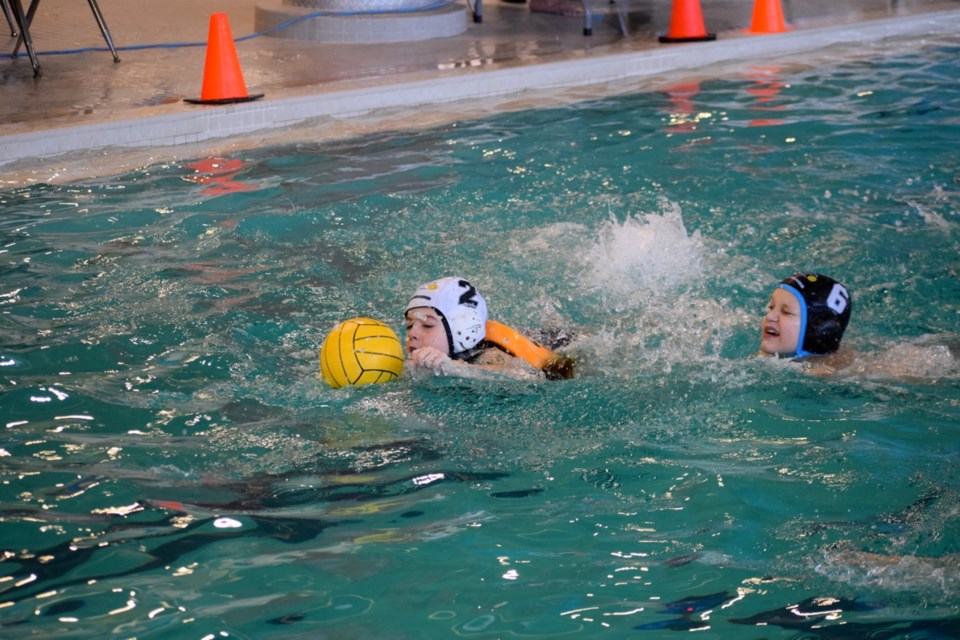 Olivia Walton (2) and Hunter Griffin (6) played for the Sharks in a mini game.