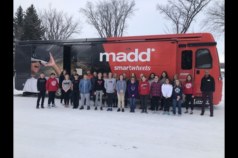 The MADD Canada SmartWheels Campaign, led by Darren Chetana, facilitator (far right), presented its message of alcohol and drug awareness to Grade 5 and 6 students at CCS on January 21 in the SmartWheels Mobile RV Classroom, assisted by the CCS SADD chapter. Chetana was photographed outside the SmartWheels RV with the CCS SADD executive, non-executive members and new recruits.