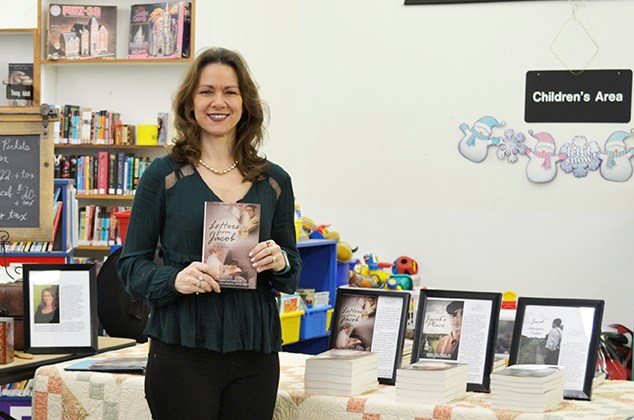 Corinne Hewitt displays her series of books inspired by life in the Cannington District.