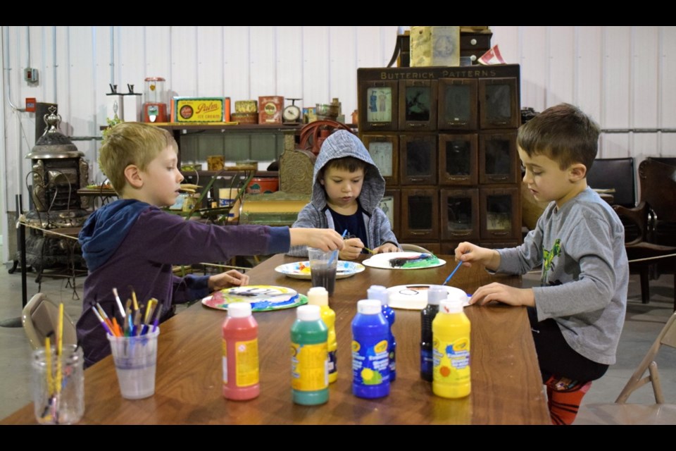 Greyson Schmollinger, Mavrik Espelien and Mason Fonstad were painting hockey masks during the Can You Build it? no school day. Photos by Anastasiia Bykhovskaia