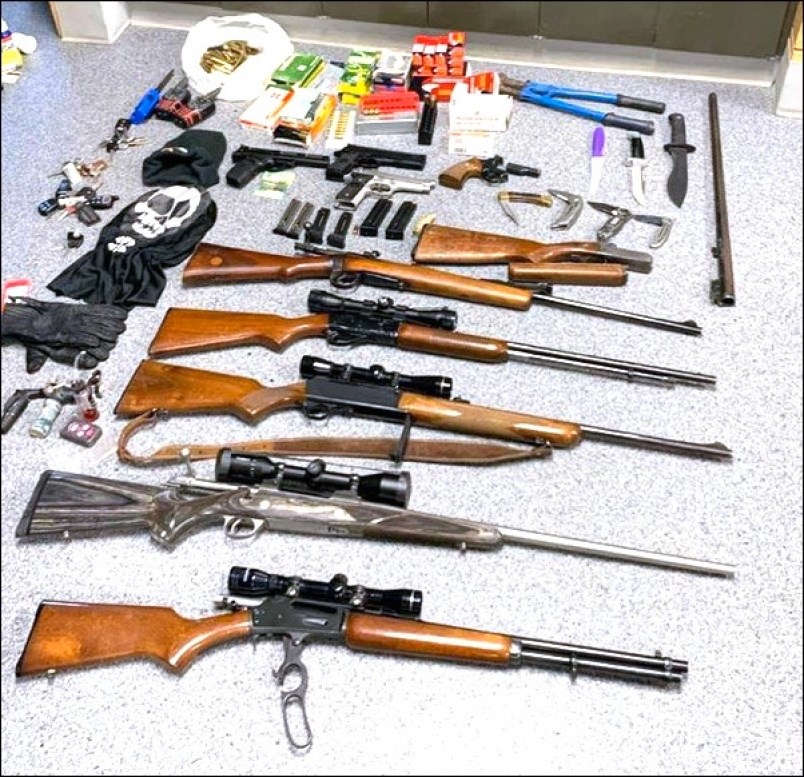 Items RCMP seized from the SUV included a machete, three semi-automatic handguns with five loaded ma