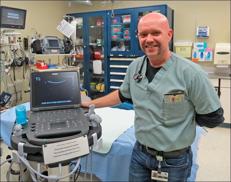 Dal Lynds, RN (Nurse Practitioner) and a POC ultrasound unit purchased with funds from the BUHF $100