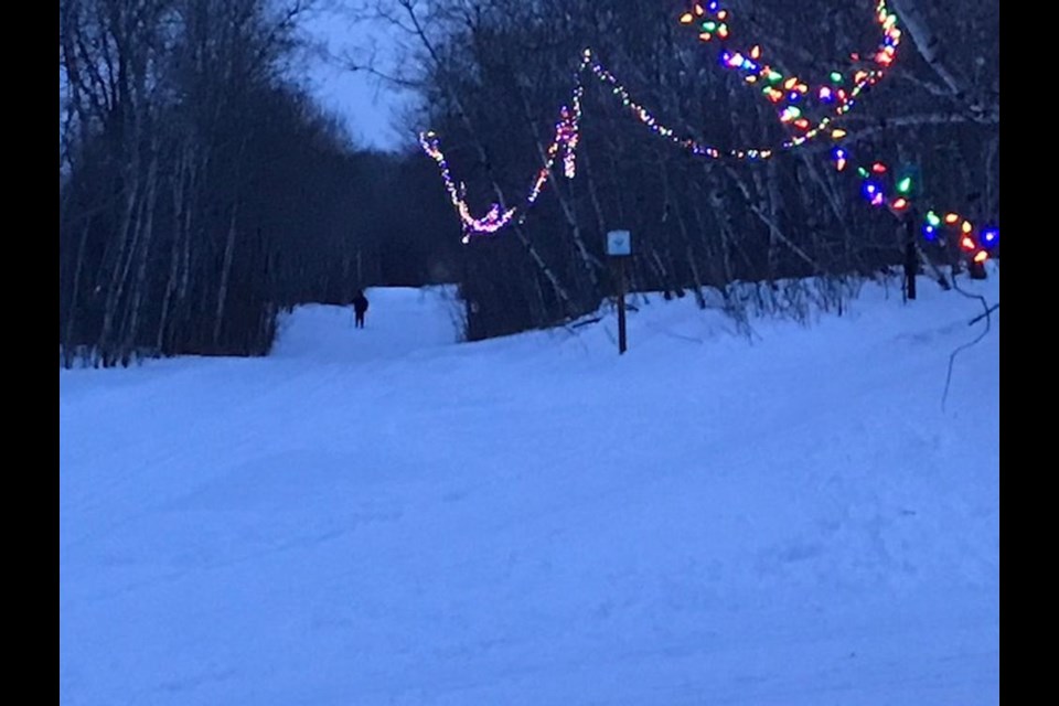 As darkness fell, trail lights took effect and guided the cross-country skiers along the course.