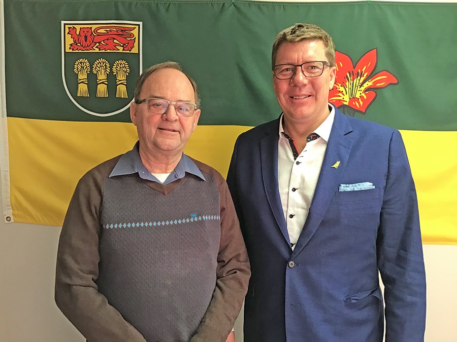 Battlefords MLA Herb Cox and Premier Scott Moe at the Battlefords constituency office Friday. Photo