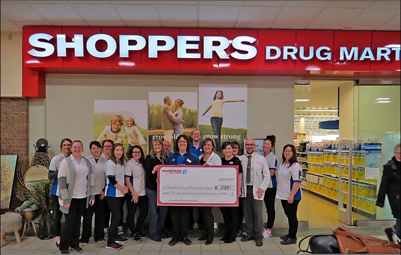 Sherry Krelow, BUH Foundation, accepts the donation from Shoppers Drug Mart, North Battleford associ