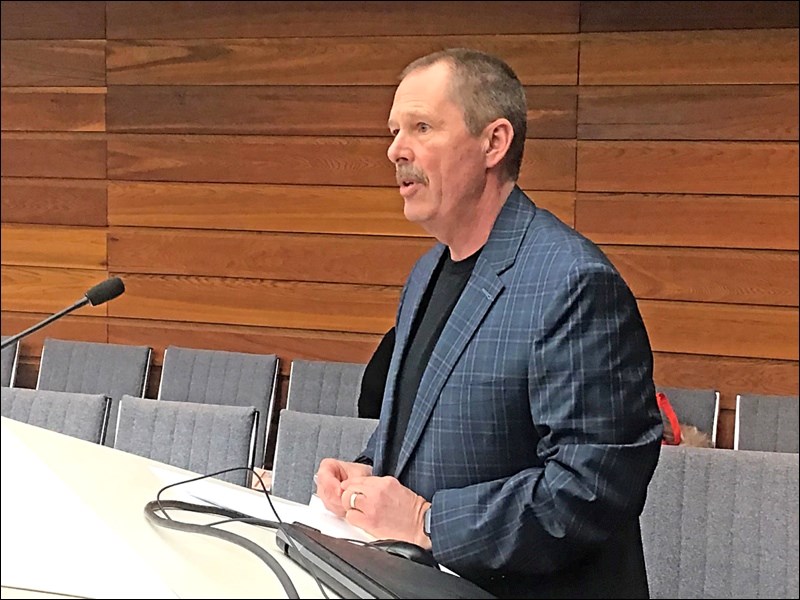 Community safety coordinator Herb Sutton gives his monthly report for February at a council meeting.