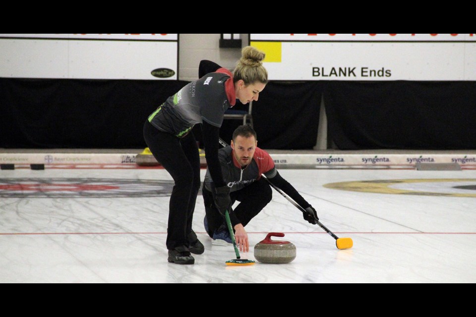 Ashley Quick and Mike Armstrong played hard the entire weekend of the Mixed Doubles Provincial Championship in Humboldt on Feb 27 to March 1. Quick and Armstrong swept the tournament with 8 wins, zero losses, and 67 to 26 score differential between themselves and the other teams. Photo by Becky Zimmer
