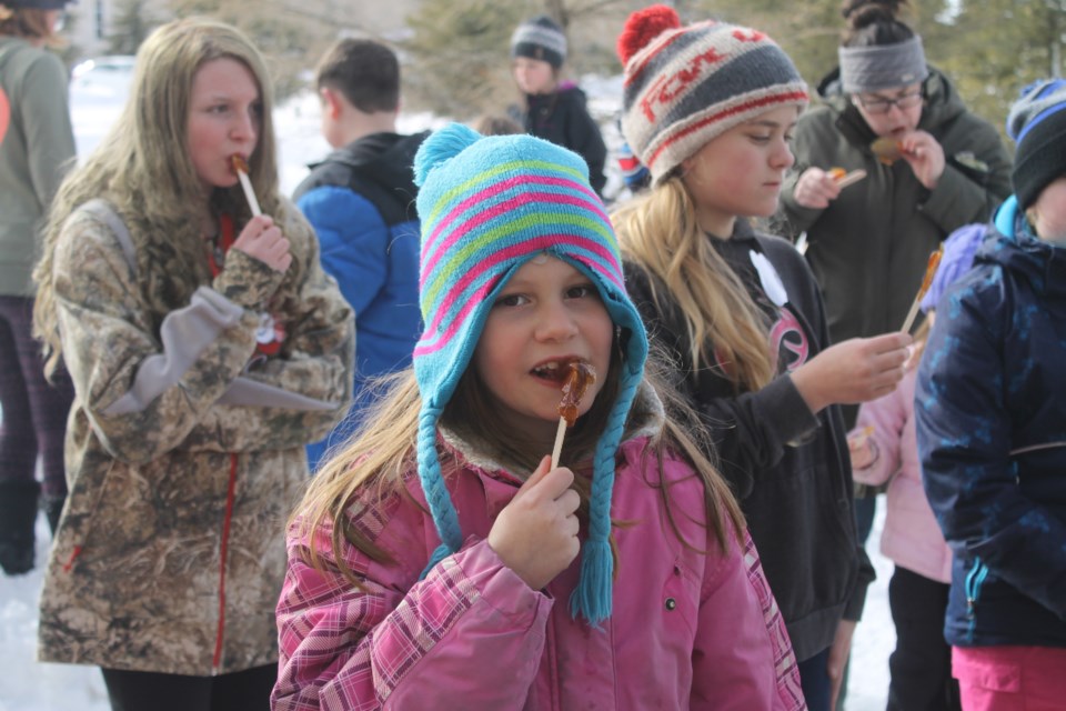 École Notre-Dame-des-Vertus in Zenon Park held a winter carnival on March 5, inviting Gronlid School and local home school families to join. This day offered a quick taste of their French-Canadian heritage with maple taffy, competitive games, snowshoeing, spinning yarn workshop, painted snow building, wagon rides and more. Photo by Jessica R. Durling