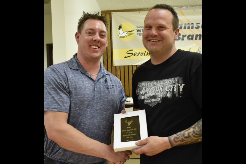 Trevor Shabatoski, right was congratulated by Tyson Leis, SWF vice-president, and presented with the award for mens typical elk measuring 295 5/8.