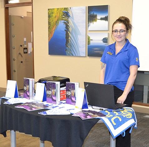 RBC Carlyle Branch Manager Kelsey Rekken gives a presentation at the discussion for fraud awareness held March 4.