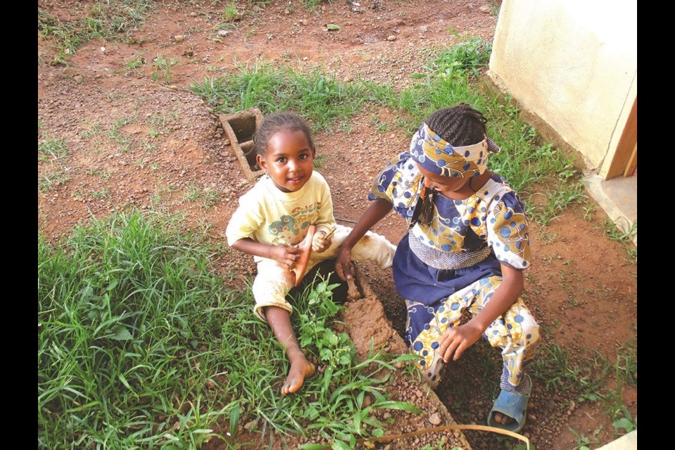 Although life is quite different in Cameroon, children are children the world over. Lisa captured this picture of two girls playing with dirt and water. “It’s another part of the world,” Lisa said with a smile, “but making mud pies is something we can all relate to.”