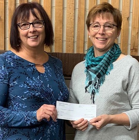 Marilyn Dyck with Soup Haven presents a cheque to Bev Fuches representing the Yorkton Curling Club.