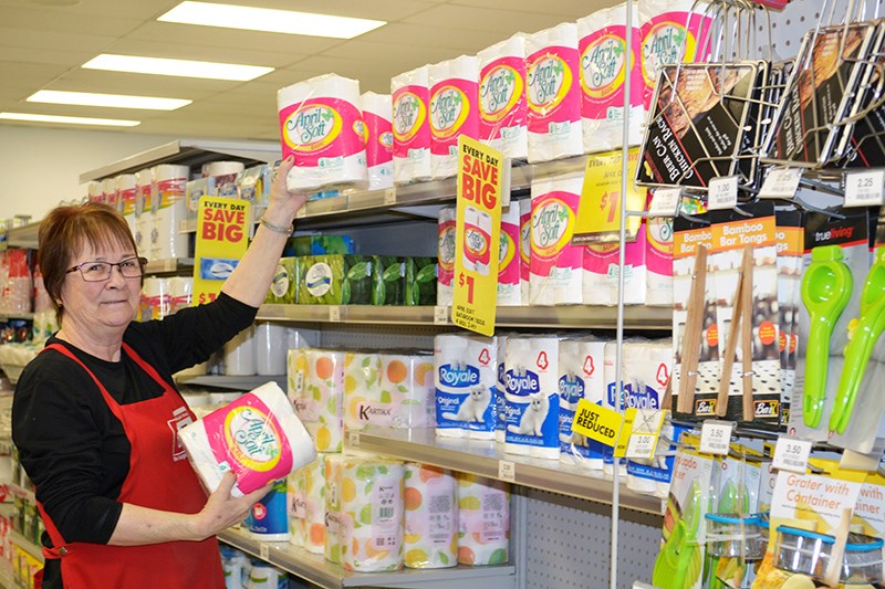 Bargain Shop employee, Val Purser has the shelves loaded up for those in need. The Bargain Shop is well stocked for this coveted commodity.