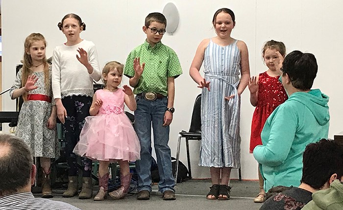 These children, led by Nicki Ford, sang and performed actions to song at the Wawota Time and Talent Auction on Mar. 15.