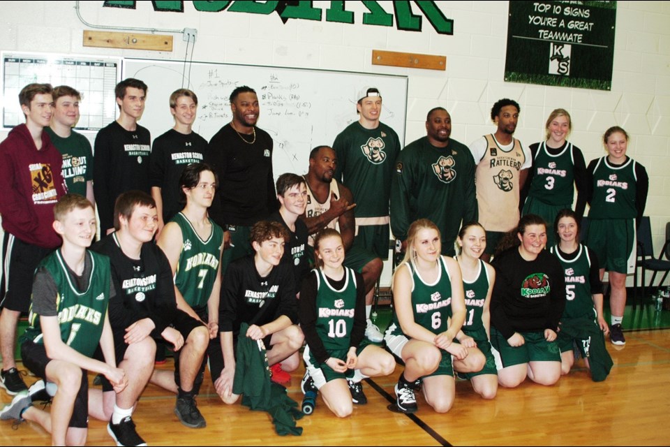 The Kenaston Kodiaks and visiting athletes get together for a group shot after the big game.