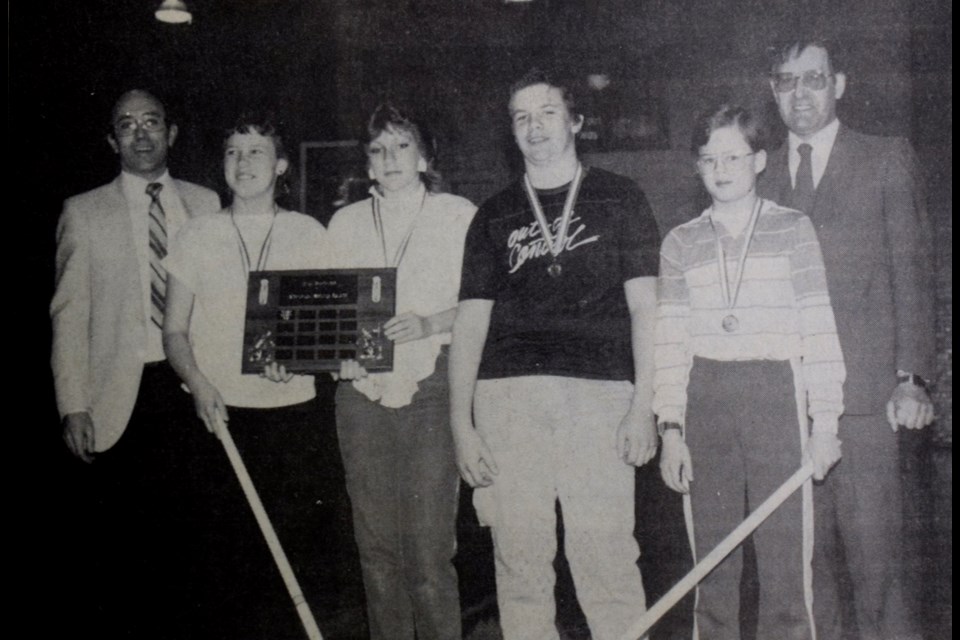 These young curlers defeated 17 other rinks to capture Estevan Junior High curling championship. From left, coach Wayne Wallace, skip Melissa Robbins, third Trina McClement, second Stewart Peters, lead Aaron Hiske and coach Ivan Knuckey.