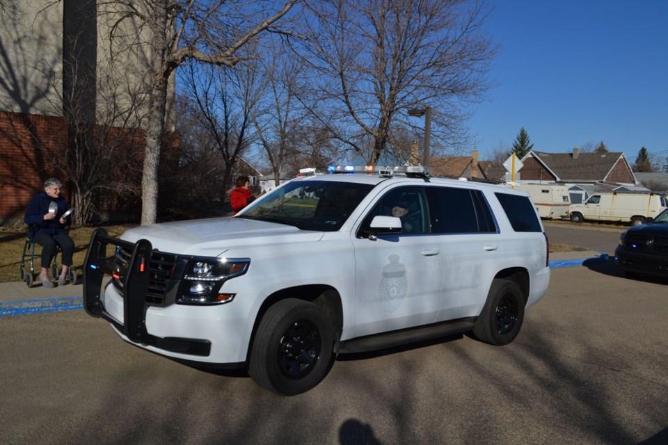 Local police drive past appreciative residents of the Valley View Heritage building.