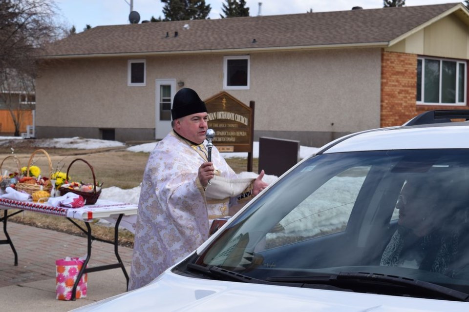 Due to social distancing made necessary by COVID-19, on April 18, Great Saturday, the blessing of Easter (Paschal) Baskets was performed by Rev. Fr. Petro Tsenov outside the Ukrainian Orthodox Church in Canora, while participants remained safely in their vehicles with their baskets.