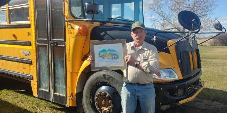 Larry Johnstone, who has served as bus driver for Unity for 37 years was presented a hand-painted rendition of his bus recognizing his retirement from service in delivering students safely for almost four decades. Photo submitted