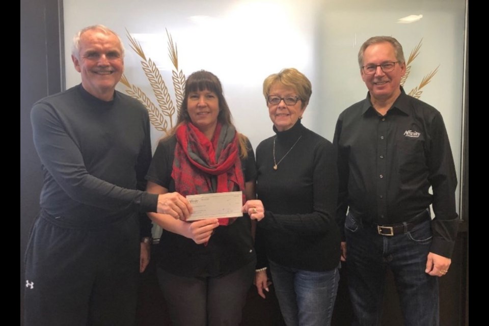 From left, Dawn Krawetz of the Sadok Ukrainian Dance Club accepted a cheque for $5,000 from Affinity Credit Union representatives Bryan Cottenie, Krawetz, Audrey Horkoff and Joe Kozakewich.