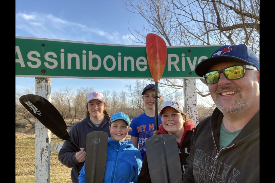 The Nelson family of Preeceville had fun exploring the Assiniboine River as they kayaked and canoed down the river on May 3. Family members, from left, were: Camryn, Trenley, Hudsyn, Shannon and Jesse.