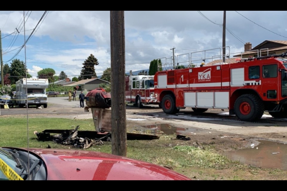 The tail of a crashed Snowbirds plane lies on Kamloops' Glenview Avenue. Photo by Braden Capostinsky