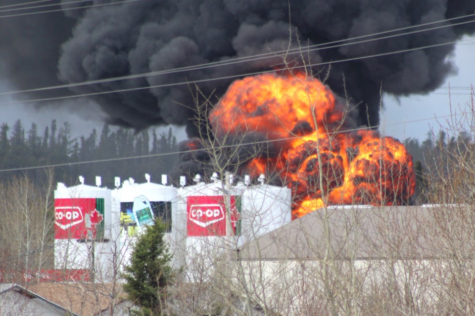 A fire burns near the Co-op cardlock gas station at Timber Lane May 22. The fire, reported shortly after noon local time, is now contained. - PHOTO BY ERIC WESTHAVER