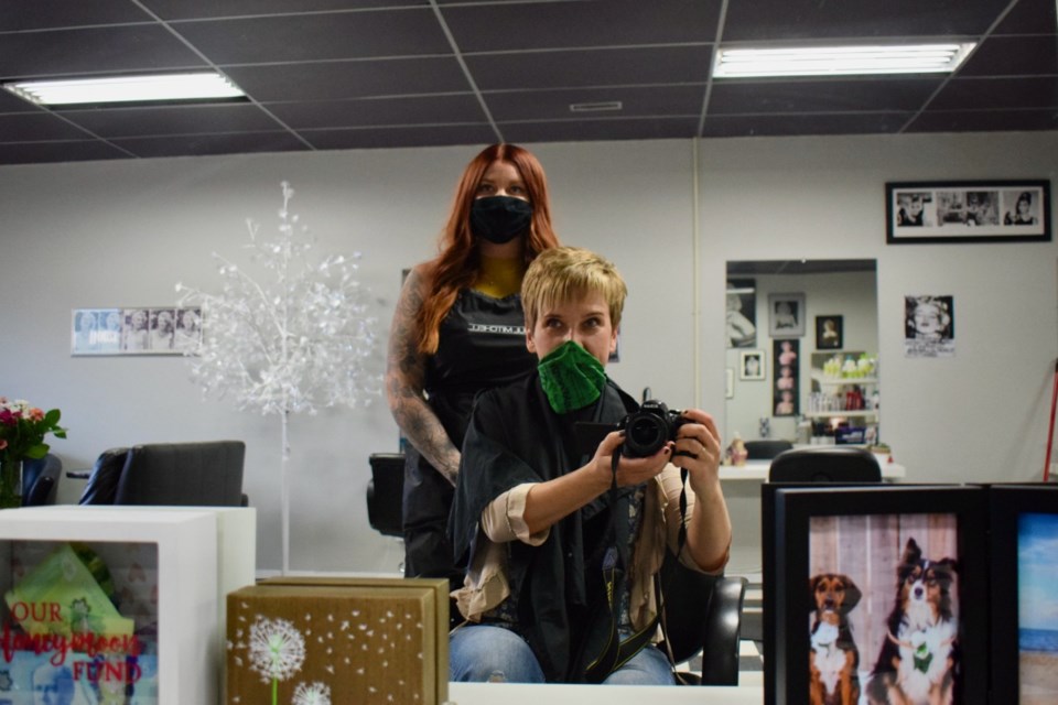 Alexis Storozuk, left, and Anastasiia Bykhovskaia at the hair studio on the first day of Re-Open Saskatchewan Phase 2.