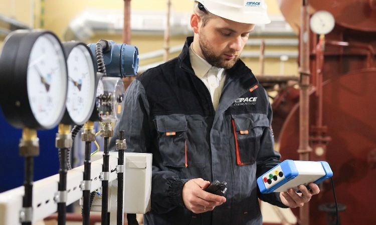 A technician performs tests and checks efficiency on a building’s water system. Photo courtesy Pace Chemicals Ltd.