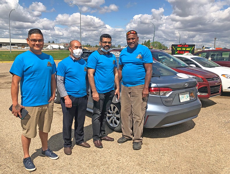 NB City Cab launched May 28. Pictured here are Warran Joseph Jr. (driver), and owners Jian Feng (Fred), Rashid Warrachi and Malakai Seru. Fourth owner Ali Khan is absent. (Contributed photo)