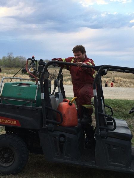 Canora firefighter Neil Reine, deputy chief, refueled the pumps as the battle with the fire continued.