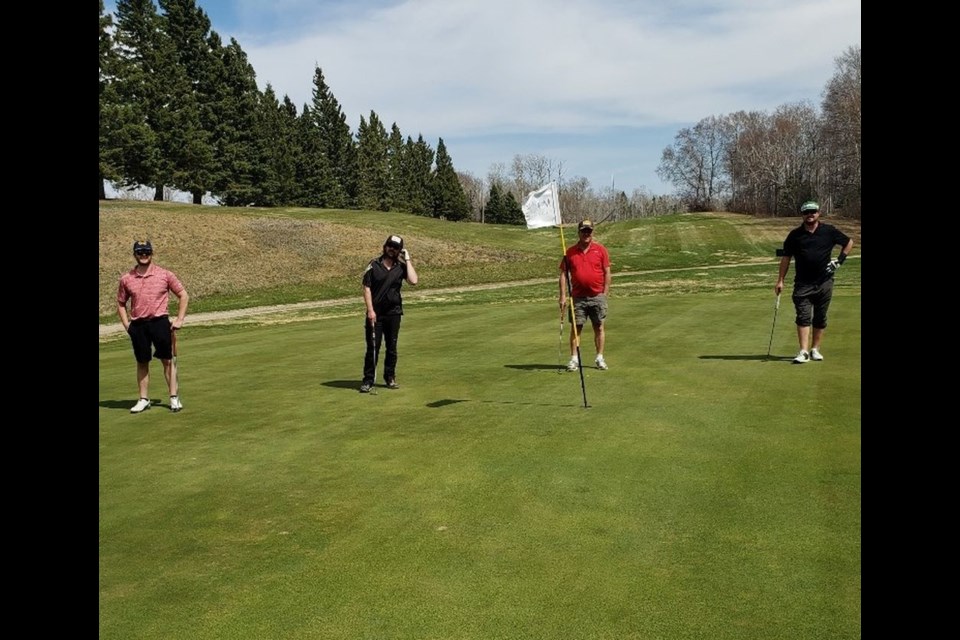 From left, local golfers Zac Fedorak, Nick Martinuik, and Brian and Jared Ruf enjoyed the nice weather at the Madge Lake Golf course on the May long weekend. (Photos submitted)
