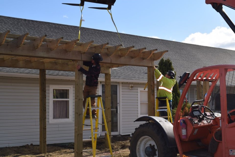 Owen Chernyk, left, and Cole Ungar of Rice Construction of Canora worked on the new permanent Farmers Market structure outside Canora's Visitor Information Center/CN Museum on May 26 and 27.