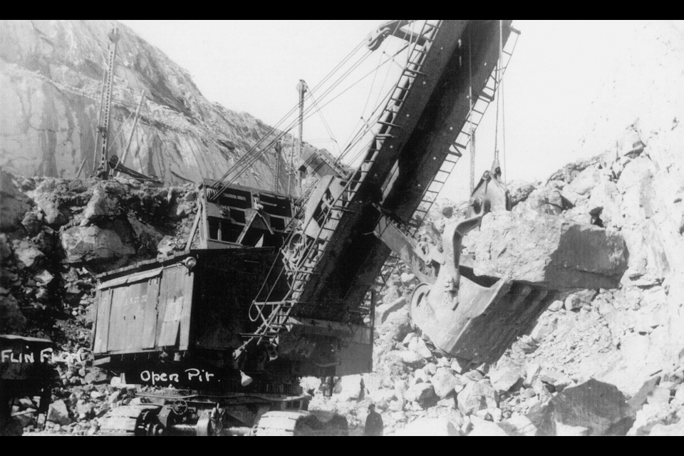 A Marion 4160 electric shovel moves chunks of blasted rock during the construction of the Flin Flon open pit mine in the early 1930s. - SUBMITTED PHOTO