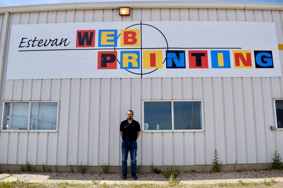 Production manager Corey Dornian, who knows the printing process from top to bottom, is pictured here in front of the Estevan Web Printing building. Photo by Anastasiia Bykhovskaia