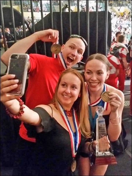 2017 Team Canada All-Girl coaches holding their bronze medal – first-ever podium finish in the Premi