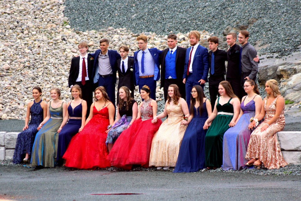 Creighton Community School grads pose on the rock steps at Creighton Avenue Park. The school held their own outdoor graduation ceremony, photo shoots and march June 19.