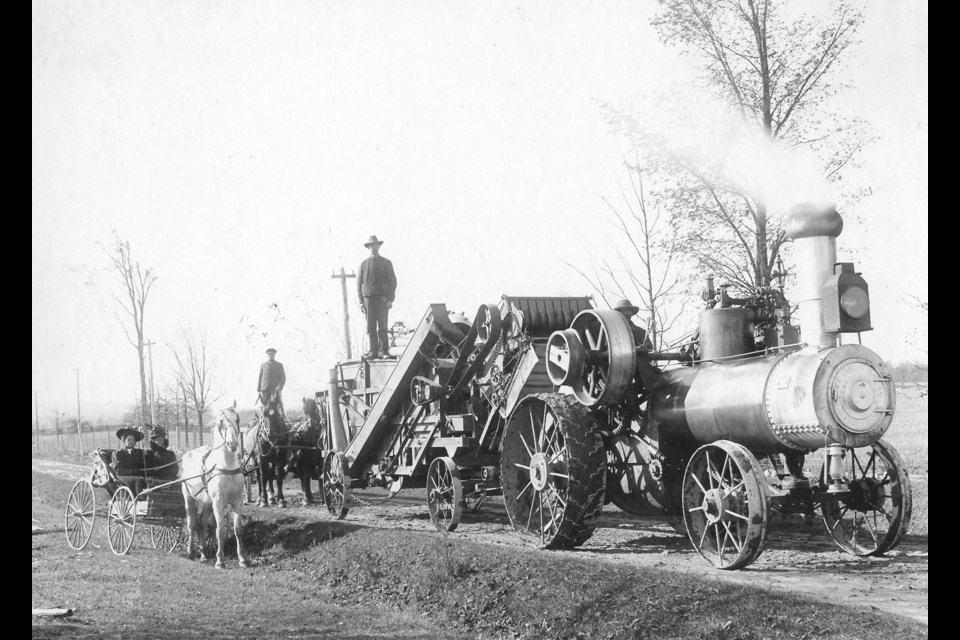 An early threshing machine on the Harris farm.
