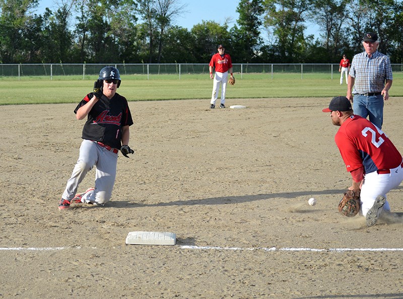 Baseball action has returned. Here the Arcola runner is safe at third advancing on an outfield hit. Arcola played its home opener against the Carlyle Cardinals on July 2.