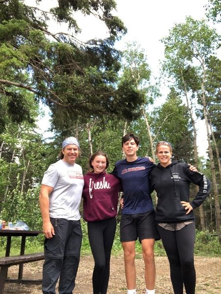 Mark Mazur, his wife Tracey, their son Owen and daughter Zoey returned to their campsite at Duck Mountain Provincial Park on July 15 and checked out the aftermath of the July 13 storm which flattened their camper. From left, were: Mark, Zoey, Owen and Tracey.