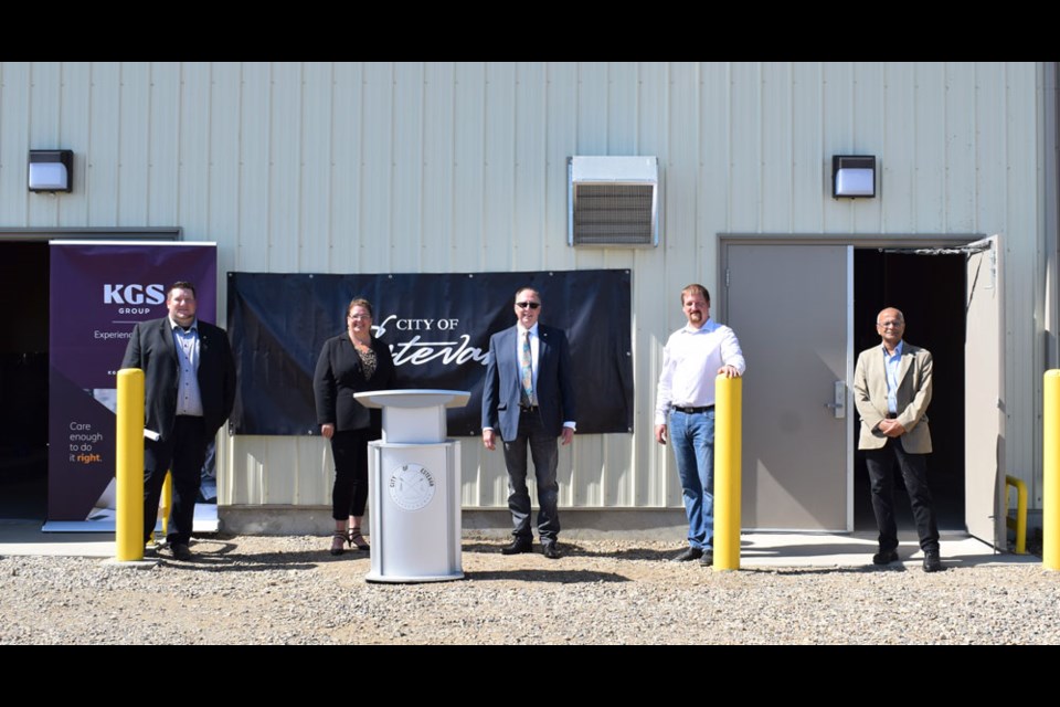 From left, city manager Jeff Ward, Minister of Government Relations Lori Carr, Estevan Mayor Roy Ludwig, water and wastewater services manager Shane Bucsis and KGS representative Milan Vora in front of the new pump house. Photo by Anastasiia Bykhovskaia