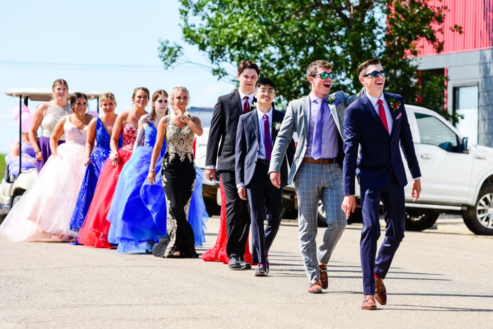 Lampman School graduates parade through the community Saturday. Photo by Wanda Harron Photography