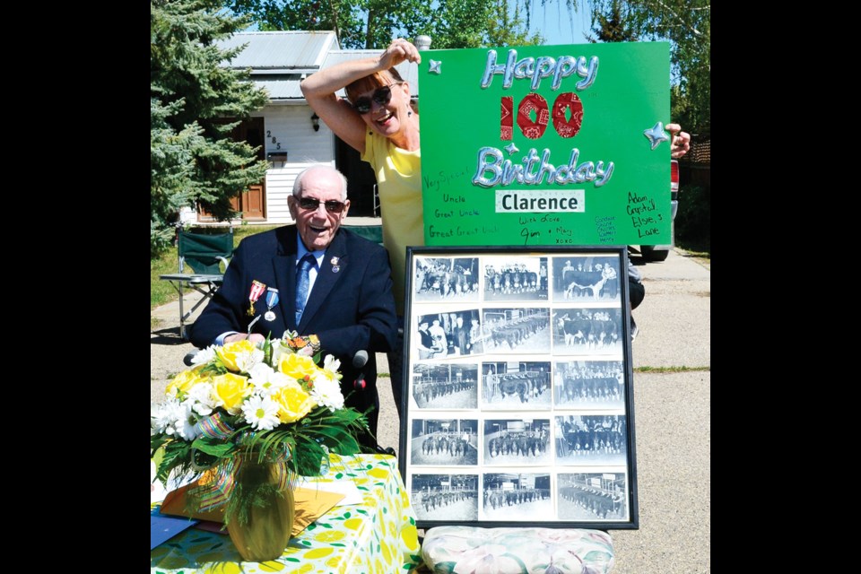 Clarence Hookenson had a parade in front of his house for his 100th birthday. Photo courtesy of the Carlyle Observer.