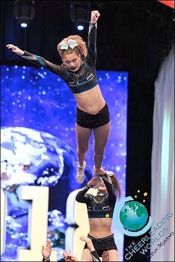 Celeste Swanson from Cheer Legacy is the flyer in this Level 5 version of a waterfall stunt. This N