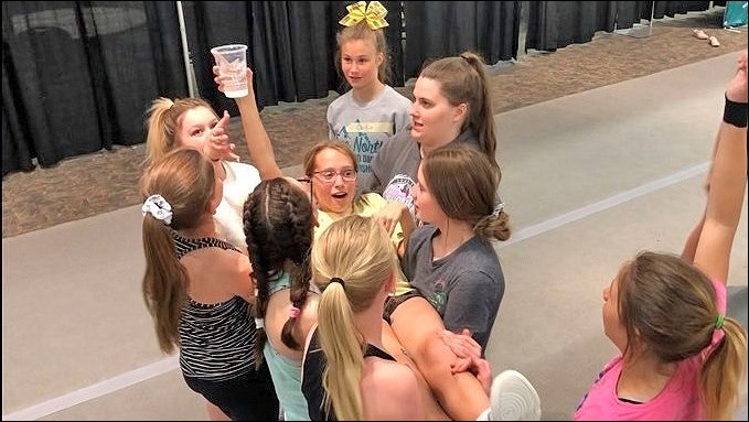 Cheerleaders at the SCA Annual Athletes Conference 2019 participate in the water glass activity – a