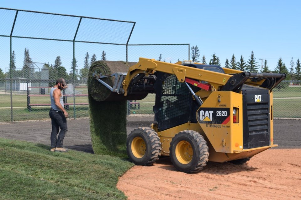 Town of Canora workers were busy laying sod on August 26 during upgrades to Al Sapieha Field, as part of efforts to promote baseball at all levels in Canora. Kris Currie gave directions while Randy Danyluk operated the skid steer and rolled out the sod.