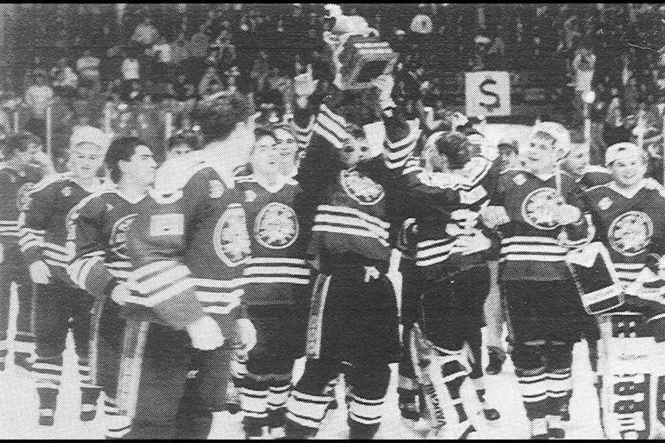 The 1993 Flin Flon Bombers hoist the SJHL championship trophy after a hard-fought Game 7 win against the Melville Millionaires. The triumph stands as the Bombers’ last league title. Photo from Reminder archives