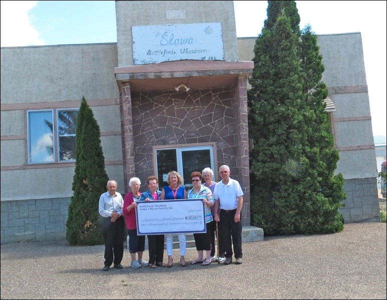 Presenting $90,000 from Battlefords Ukrainian Senior Citizens Society No. 184 to BUH Foundation - Pa