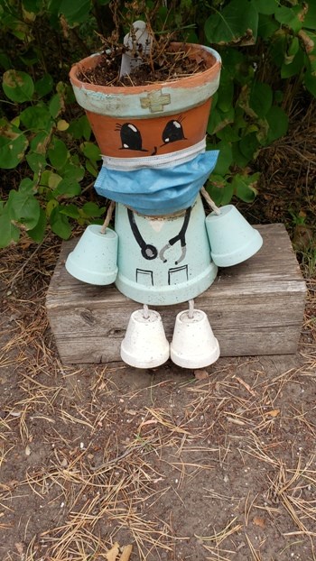 The memory garden at the Unity Hospital offers a subtle message about the importance of masks during these pandemic times. Photo by Sherri Solomko