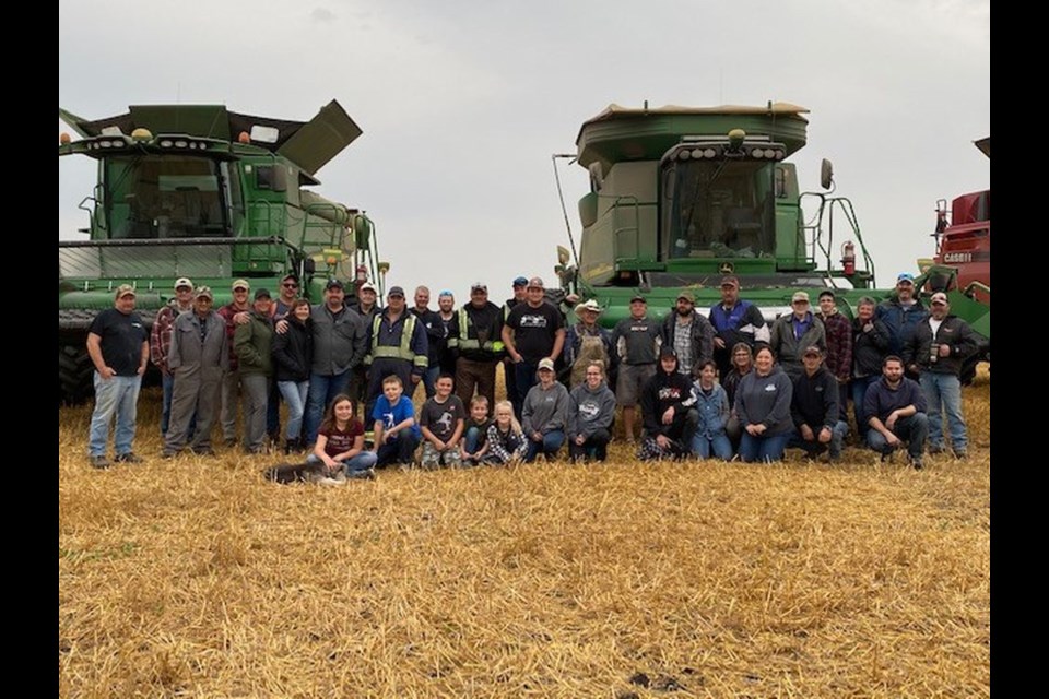 About 50 volunteers assembled at the farm of the late Mark Strutynski near Stornoway last week to harvest 400 acres of oats. This is a photograph of some of the friends and neighbours who helped with the harvest.